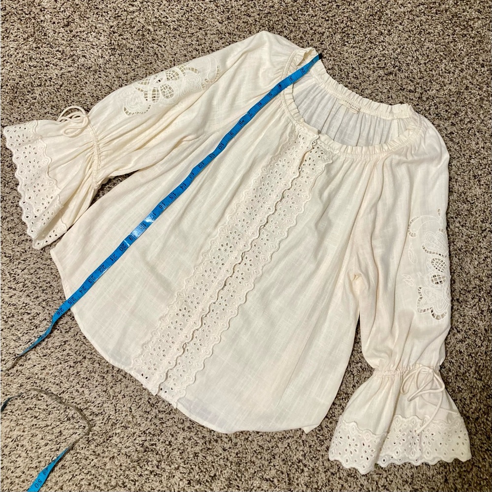 Lovestitch , embroidered blouse with lace detail.